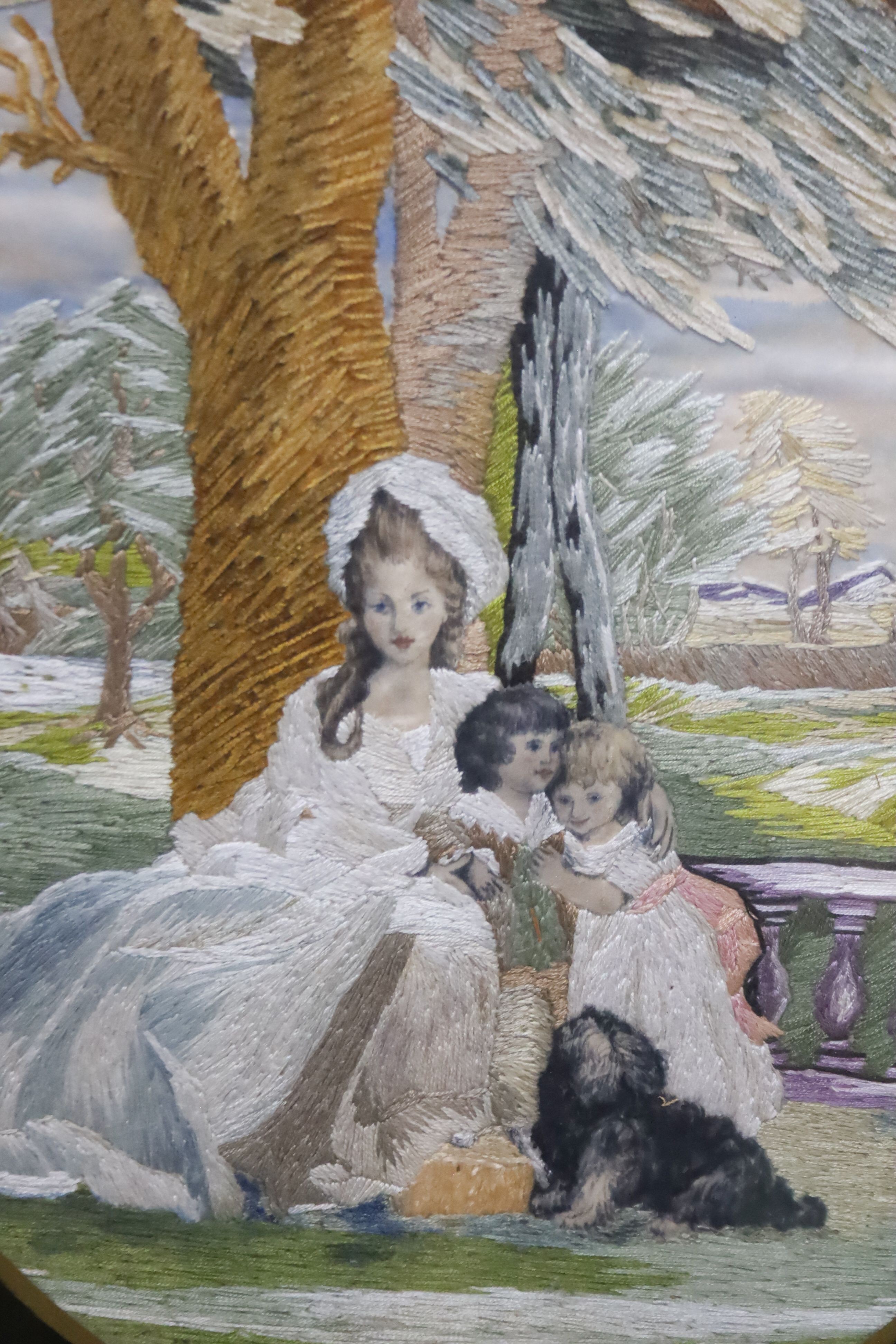 A framed oval Regency silk panel. 40cm long excl frame